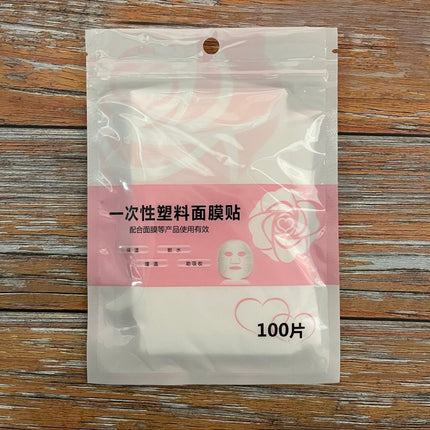 100ชิ้น/ซอง ร้านเสริมสวย แบบใช้แล้วทิ้ง ฟิล์มรักษาความสด พอกหน้า พลาสติกใส สปา กระดาษมาส์กหน้า แผ่นพลาสติกใสมาร์กหน้า